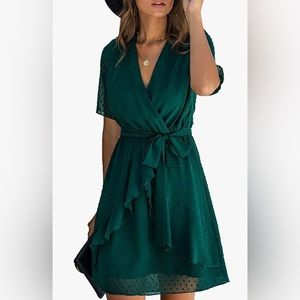 Size large. Wrap style dress with tie. Ruffle detail down the front.